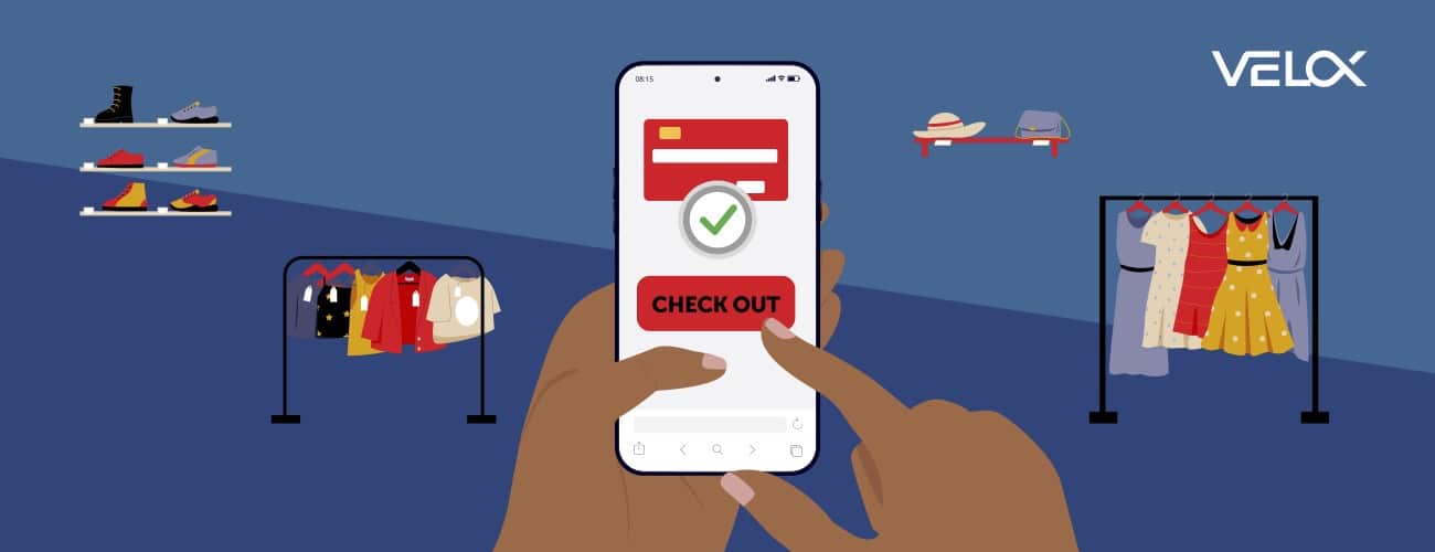A person holds a smartphone with a check out screen displayed and their finger hovering over the "Check Out" button. Beyond the phone is a rack of clothing and shelves with shoes and hats.